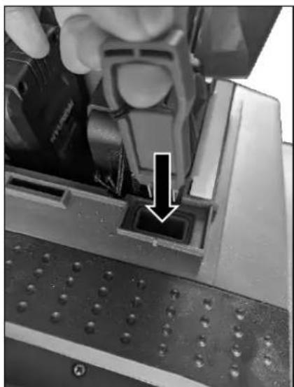 Close-up of a hand pressing a button on a computer interface (no visible text or symbols)
