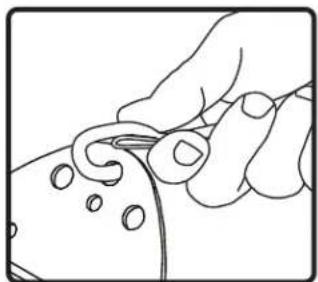 Line drawing of a hand holding a small object with circular holes, no text or symbols present