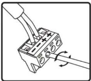 Diagram of a hand using a tool to adjust or install a component with arrows indicating rotation (no text or symbols present)