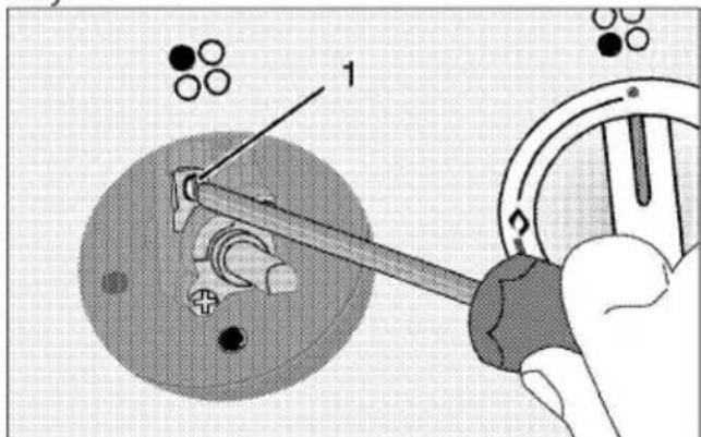 Technical diagram showing a mechanical assembly with labeled components and a hand operating a tool, possibly for assembly or maintenance.
