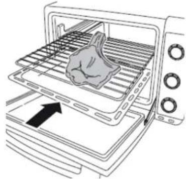 Line drawing of a toaster oven with a hand placed inside, showing the interior and exterior view (no text or symbols)
