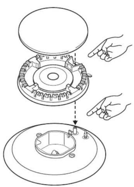 Technical diagram showing hand positioning of a mechanical component with labeled parts and directional arrows