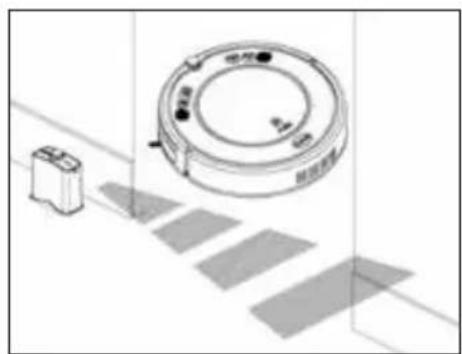 Technical line drawing of a circular device with a rectangular base and a small rectangular component, placed on a grid-patterned surface (no text or symbols)