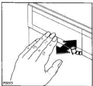 Hand holding a tool interacting with a panel, no visible text or symbols