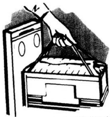 Illustration of a hand using a tool to clean or store items from a filing cabinet (no text or symbols visible)