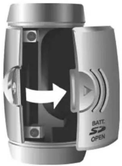 Close-up of a metallic cylindrical device with internal components and directional arrow, no visible text or symbols