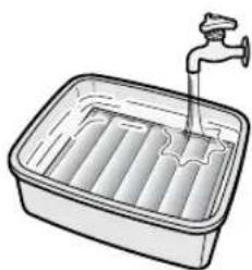 Illustration of a faucet inserted into a rectangular basin with water-filled compartments (no text or symbols)