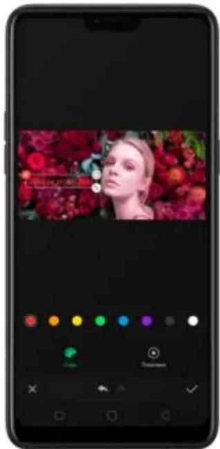 Smartphone screenshot displaying a video thumbnail with a woman's face and color adjustment sliders below.