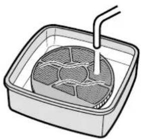 Illustration of a square container with a side dish and a piping bag (no text or symbols)