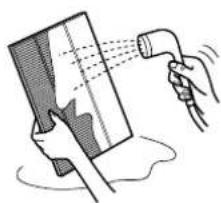 Illustration of a hand holding a rectangular object with a hose emitting mist, no text or symbols present