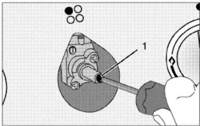 Technical diagram showing a mechanical assembly with labeled component '1' and circular components, likely illustrating a tool or procedure.