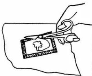 Hand-drawn sketch showing scissors cutting a card with a tree symbol, likely illustrating a cut or editing process.