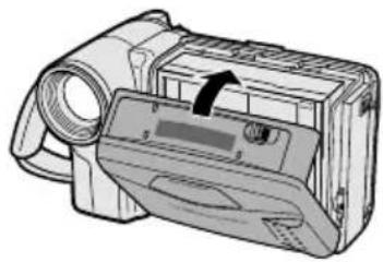Illustration of a digital camera with an arrow indicating the lens (no text or symbols present)