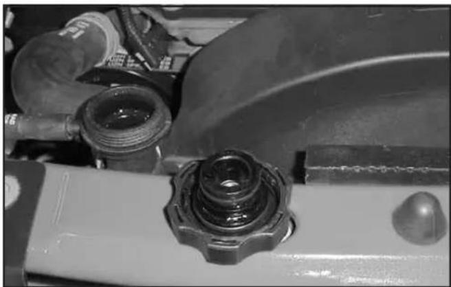 Close-up of mechanical components including a bolted bearing and tubing (no visible text or symbols)