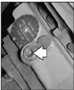 Close-up of a mechanical component with a highlighted circular feature and an arrow pointing to it (no visible text or symbols)