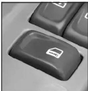 Close-up of a black keyboard key with a white icon on the button.