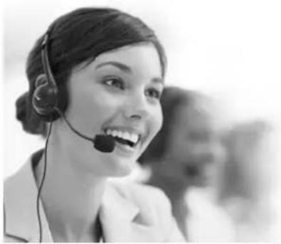 Black and white photo of a woman wearing a headset and smiling (no visible text or symbols)