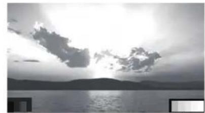Black-and-white landscape photo of a lakeside at sunset with scattered clouds and distant hills (no text or symbols)
