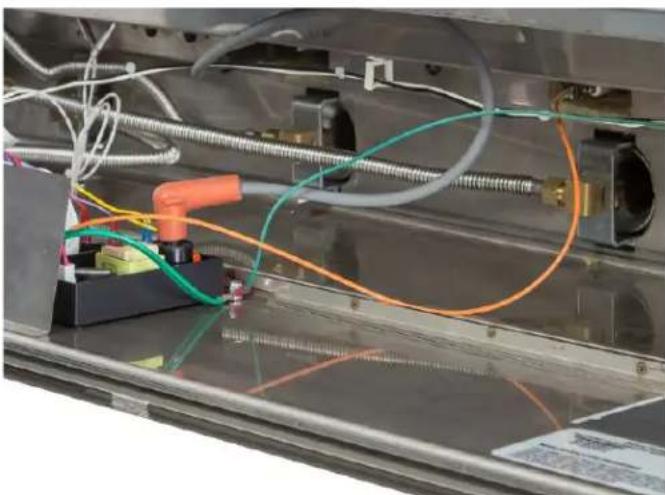 Close-up of a mechanical assembly with colored wires and tubing (no visible text or symbols).