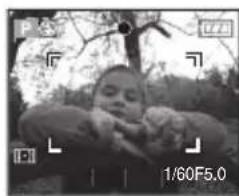 Black-and-white photo of a person outdoors with trees and foliage in the background (no visible text or symbols)