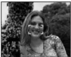 Black-and-white photo of a smiling woman outdoors with trees in the background (no visible text or symbols)