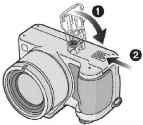 Diagram of a camera module with labeled parts and directional arrows indicating assembly or operation.