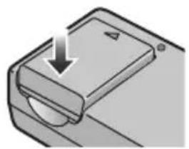 Diagram of a mechanical component with a downward arrow indicating force or movement (no text or symbols)