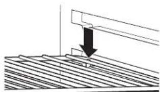 Diagram showing a mechanical component with an arrow indicating downward motion (no text or symbols present)