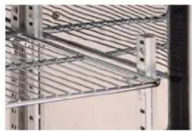 Close-up of a metal shelving rack with grid lines and vertical supports (no visible text or symbols)