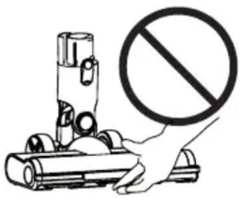 Diagram showing a hand holding a vehicle with a prohibition symbol, next to a cylindrical device with wheels and a handle.