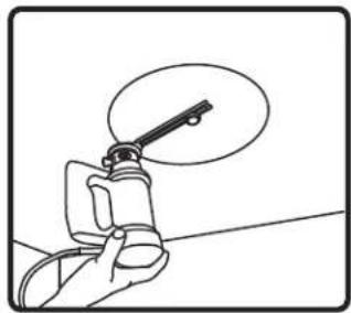 Hand holding a tool with a magnified view of the tip (no text or symbols visible).