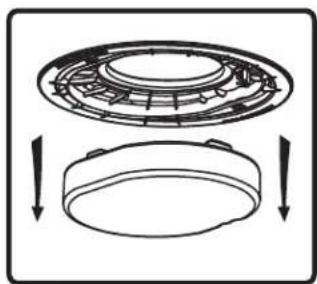 Diagram showing a circular mechanical component with internal structure and two downward arrows indicating motion or assembly (no text or symbols)