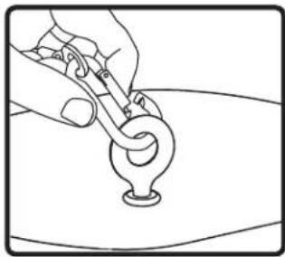 Line drawing of a hand holding a tool over a curved object (no text or symbols)