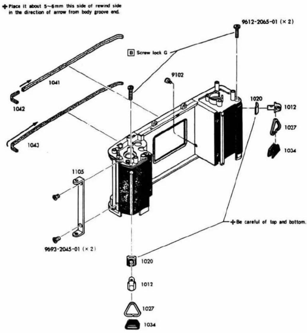 Place it about 5~6mm this side of rewind side in the direction of arrow from body groove end. 9612-2065-01 (× 2) B Screw lock G 9102 1041 1042 1043 1105 9693-2045-01 (× 2) 1020 1012 1027 1034 1020 1027 1034 Be careful of top and bottom.