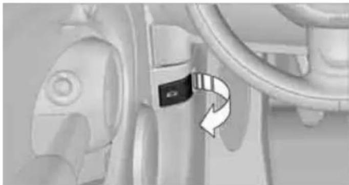 Close-up of a mechanical component with a black clip and directional arrow indicating rotation (no text or symbols)