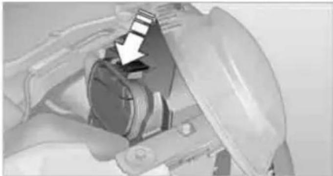 Close-up of a mechanical component with a white arrow pointing to a section (no visible text or symbols)