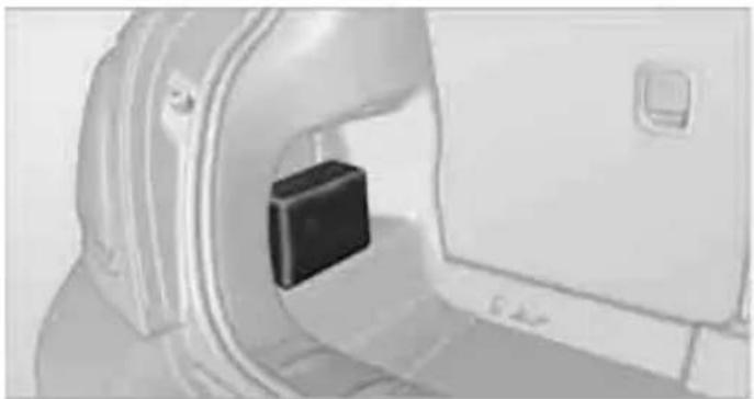 Close-up of a medical imaging scanner with a black rectangular device inserted into the chamber (no visible text or symbols)