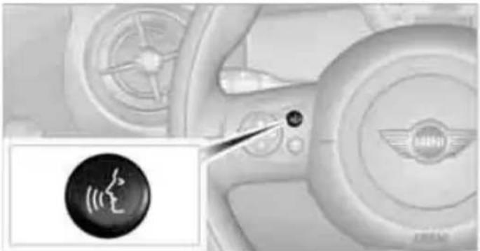 Interior view of a car dashboard with steering wheel and indicator lights (no readable text or symbols)