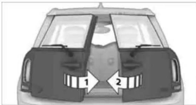 Top-down view of a car showing front and rear compartments with directional arrows labeled 1 and 2 (no text or symbols beyond labels)