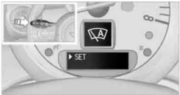 Camera dial interface with labeled controls and a 'SET' button, showing a speedometer icon and directional arrow.