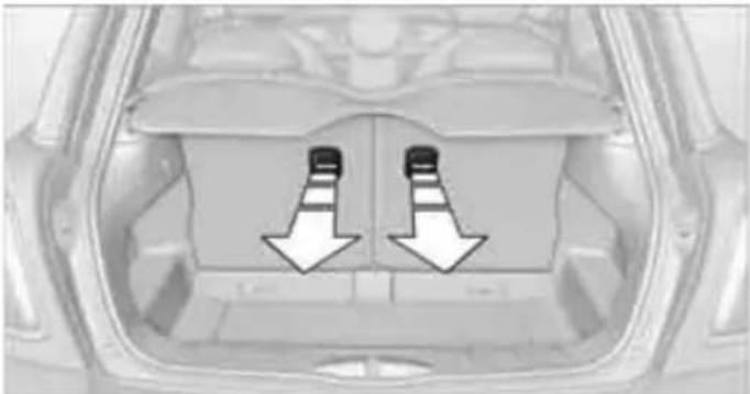 Top-down view of a car interior showing two white arrows pointing downward to the back panel (no text or symbols)