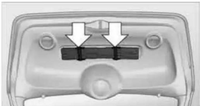 Top-down view of a vehicle head panel with two white arrows pointing to a black rectangular component (no text or symbols visible)
