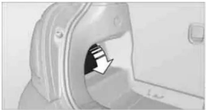 Close-up of a medical CT scanner with an arrow pointing to the opening (no visible text or symbols)