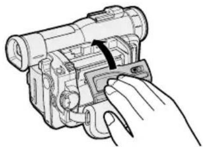 Hand inserting a component into a device (no text or symbols visible)