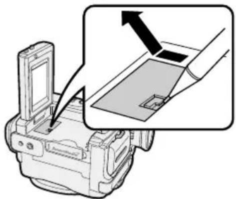 Diagram showing a camera module being inserted into a device, with an arrow indicating the process (no text or symbols present)