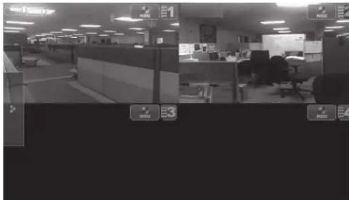 Black-and-white photo of an office interior with visible desk signs and control buttons, likely from a security or monitoring system.