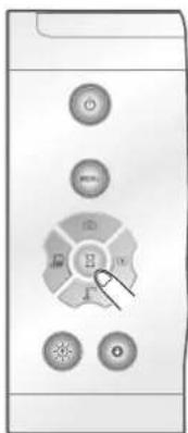 Control panel with labeled buttons including 'OK', 'Cancel', and 'E' with a cursor pointing to the 'E' button.