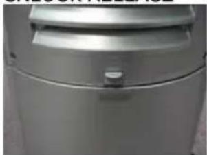 Close-up of a metallic toilet or shower unit with a handle and lid (no visible text or symbols)