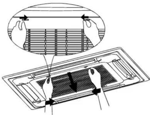Diagram showing hand positioning of a ventilation grille on a fan, with magnified detail highlighting the structure.