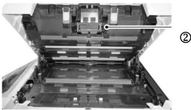 Interior view of a printer's internal structure showing the open lid and drive mechanism (no text or symbols visible)